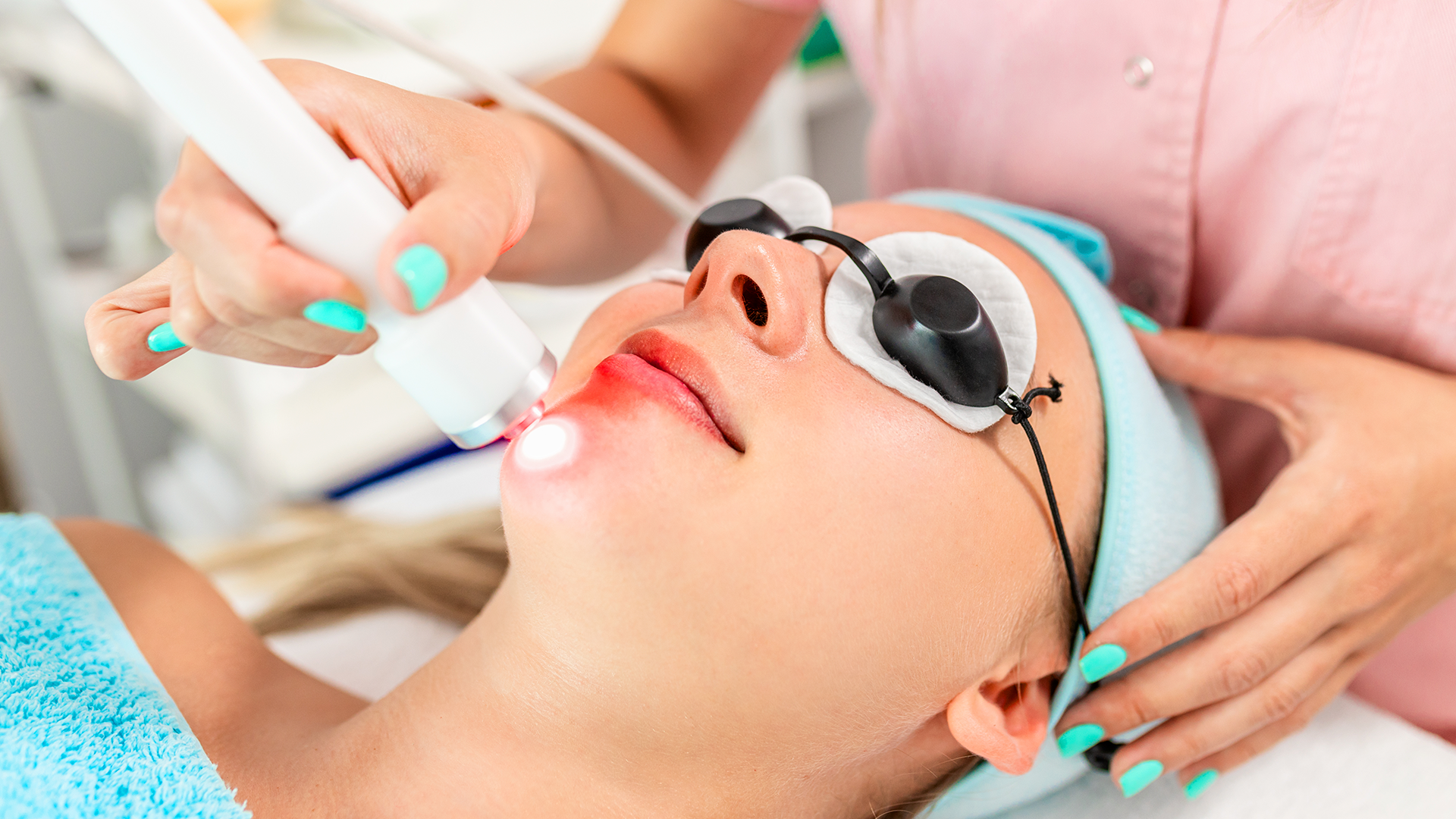 receiving-facial-laser-treatment-from-professional-2026-03-18-05-24-17-utc
